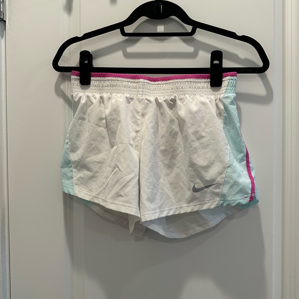 white nike shorts with pink and blue accents